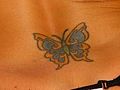 Butterfly on her lower back