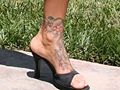 Flowers on her left ankle and foot (right side view)